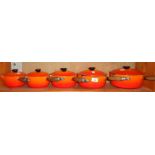 Graduated set of five Le Creuset saucepans