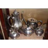 Three piece silver plate tea set and two Victorian silver plated tea pots