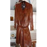 Vintage clothing: 1970s man's brown leather overcoat together with matching suitcase
