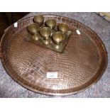 Arts & Crafts beaten copper tray by Joseph Sankey & Sons and a tray of six Indian brass egg cups
