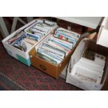 Three boxes of assorted postcards