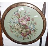 Floral woolwork picture in round wood frame