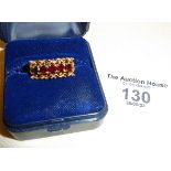 9ct gold dress ring with bar of five garnets, approx. UK size L and weight 2g.
