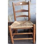 Old child's chair with rush seat