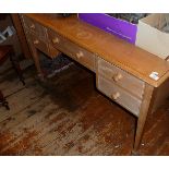Edwardian limed beechwood kneehole writing desk having five drawers on square tapering legs