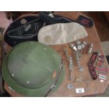 Vintage military caps, badges and whistles