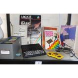 A Sinclair ZX81 home computer with manuals and discs etc.
