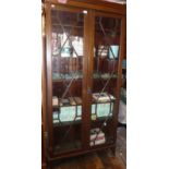 Edwardian inlaid mahogany bookcase, having two astragal glazed doors enclosing six adjustable