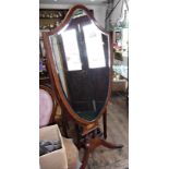 Edwardian inlaid mahogany Regency style shield-shaped cheval dressing mirror on platform base with