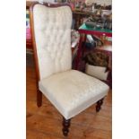 Victorian button back upholstered nursing chair with turned mahogany legs