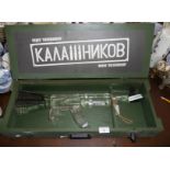 A Limited Edition presentation glass vodka bottle in the form of a Kalashnikov rifle (unopened) in a