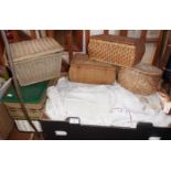 Assorted linen and five wickerwork sewing baskets