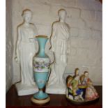 Two plaster statues, Continental porcelain chess playing group and a painted glass vase