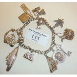 Silver bracelet hung with many charms - some lower grade silver. Total approx weight 56g