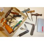 Assorted old corkscrews and penknives including a Boy Scout knife marked with the military arrow and