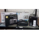 Canon 700D camera kit, a Fujifilm Finepix S6800, an Olympus AFI Twin, a Nikon Coolpix and a Konica