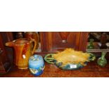 Early glazed pottery pitcher, Continental majolica dish, Devon Pottery tobacco jar and another