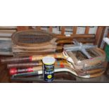 Eight vintage and antique tennis racquets and presses