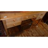 Edwardian limed beechwood kneehole writing desk having five drawers on square tapering legs