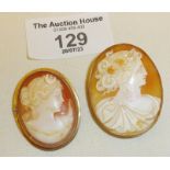 Two antique shell cameo brooches, one frame marked as 14ct, and the other tests as gold. (largest