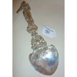 Large and ornate Victorian silver ceremonial spoon, with a figural finial in the form of Queen