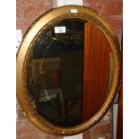 Gilt framed oval wall mirror