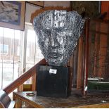 Contemporary silver painted resin sculpture of a bust with three faces on black cube plinth, 44cm