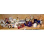Shelf of china teapots, glasses, etc.