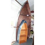 Two painted wood wall hung boat shaped display shelves