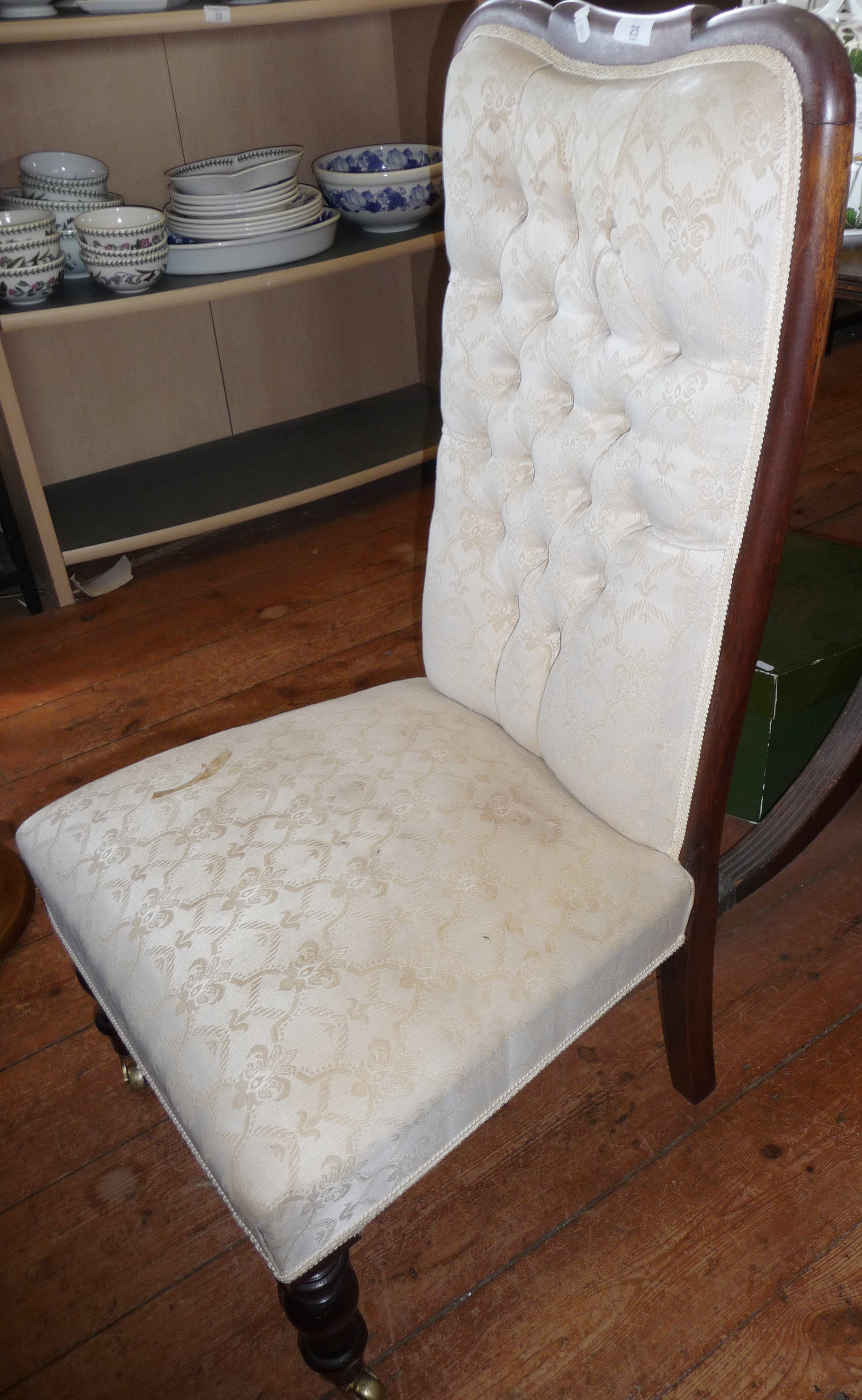 Victorian button back upholstered nursing chair with turned mahogany legs