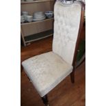 Victorian button back upholstered nursing chair with turned mahogany legs