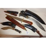 A Kukri, two small Kukris and other tribal knives