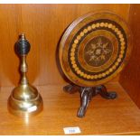 Victorian brass hand bell and an apprentice piece in the form of a miniature inlaid tilt top table