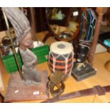 African carved wood figural table lamp, drum, stone carving and a leather sheathed short sword