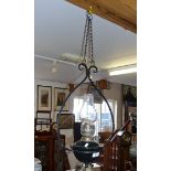 Edwardian Arts & Crafts wrought iron hanging oil lamp with green glass reservoir