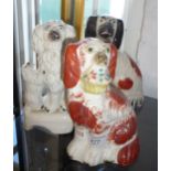 Staffordshire dog with basket of flowers, another with standing puppy and another similar