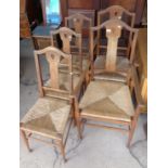 Set of 5 Arts & Crafts rush seated dining chairs, inc. 2 carvers (A/F)