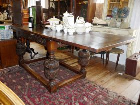 18th c. refectory style drawleaf table on bold carved legs with stretcher and carved frieze. Approx.