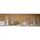 Shelf of Lladro and continental porcelain figures on metal bases (some A/F). Also including a Lladro