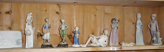 Shelf of Lladro and continental porcelain figures on metal bases (some A/F). Also including a Lladro