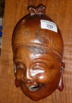 Indonesian carved and polished hardwood wall face mask