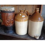 Two stoneware flagons and an African drum