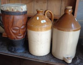 Two stoneware flagons and an African drum