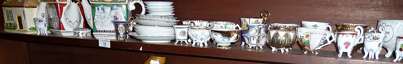 Collection of china cabinet cups and saucers with three teapots