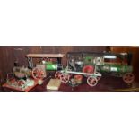 Old scratch built steam traction engine model, a Mamod Steam Tractor, with logs trailer and a