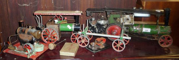 Old scratch built steam traction engine model, a Mamod Steam Tractor, with logs trailer and a