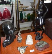 Six items including unusual African carved hardwood figure, a similar bust, a carved stone buddha