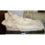 19th c. alabaster figure of a reclining Venus on a green marble base and alabaster bun feet, approx.