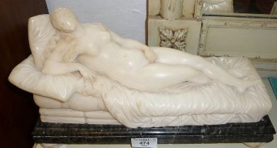 19th c. alabaster figure of a reclining Venus on a green marble base and alabaster bun feet, approx.