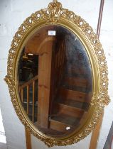 Gilt framed oval wall mirror